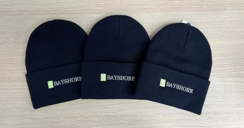 Bayshore hats after the embroidery process. Apparel branding for Bayshore contributed to brand visibility.