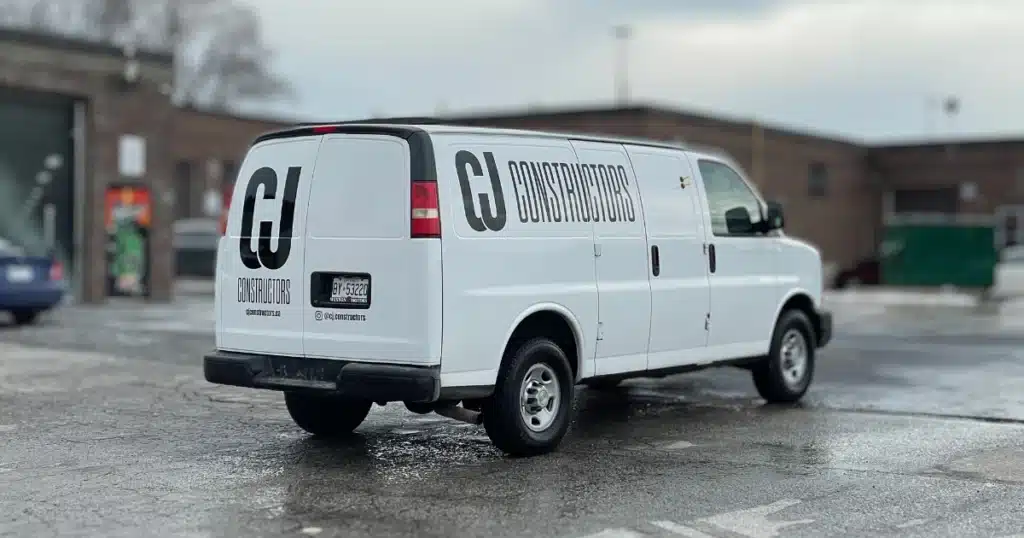 Chevy Express van after the design process of their van graphics. From the passenger side and rear view.