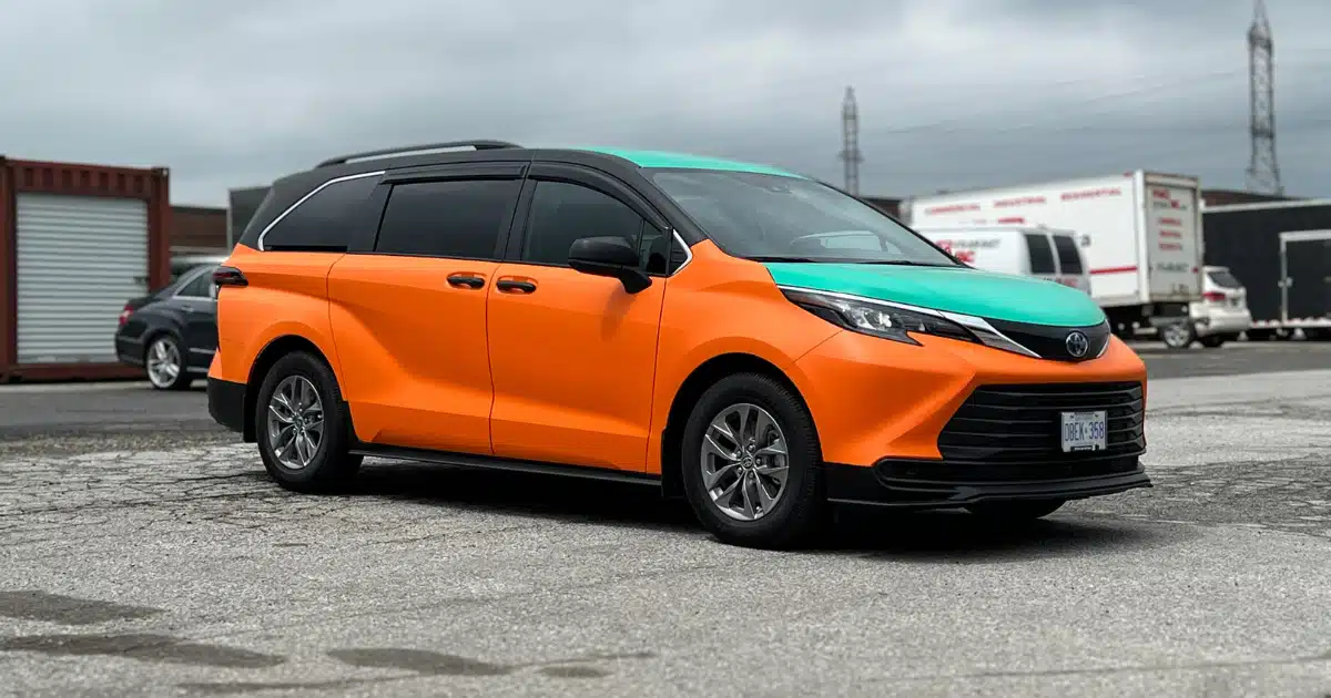 Beck Taxi wrap on Toyota Sienna. Taken from passenger front view.