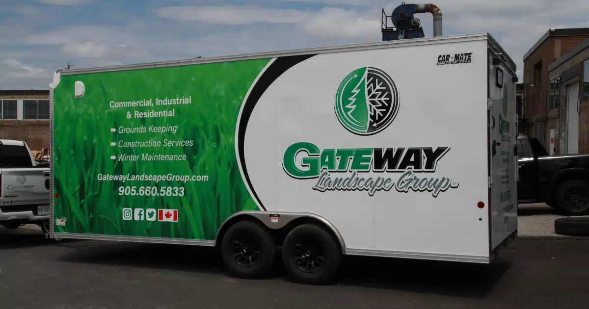 Gateway Landscape Group with full driver's side view of the graphics. The graphics include social media icons, full logo, website, phone number, specialties.