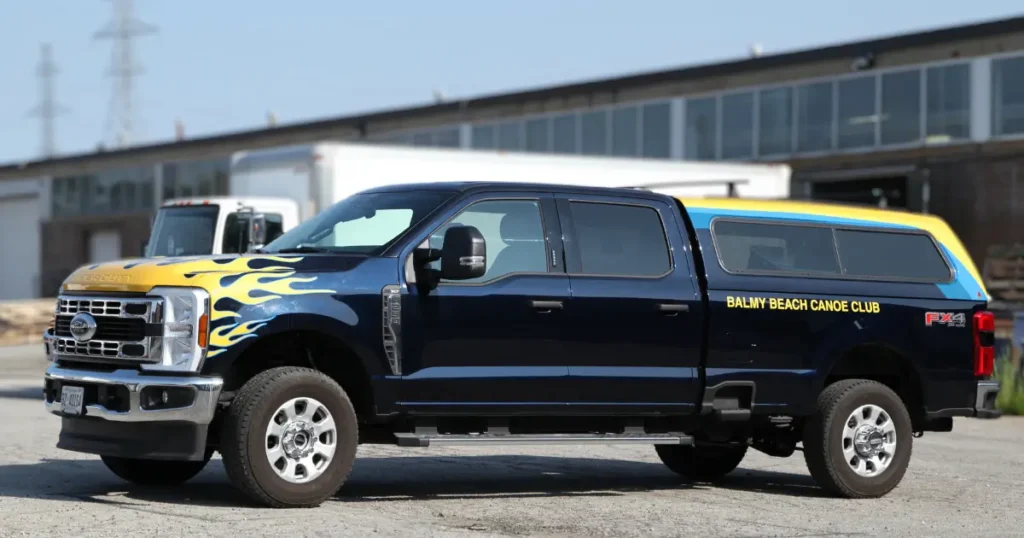 Side view of a Ford F-250 showcasing custom decals