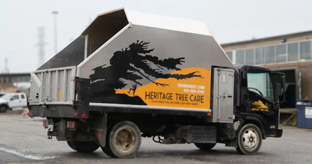 Side view of a truck displaying partial wrap decals