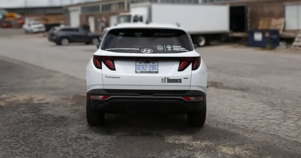 Hyundai Tucson decals on Toronto Community Crisis Services company vehicle. Photo taken from rear angle of the vehicle.