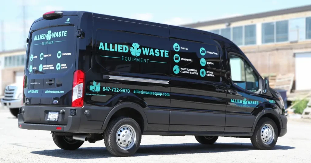 Three-quarter view of a Ford Transit displayed with decals