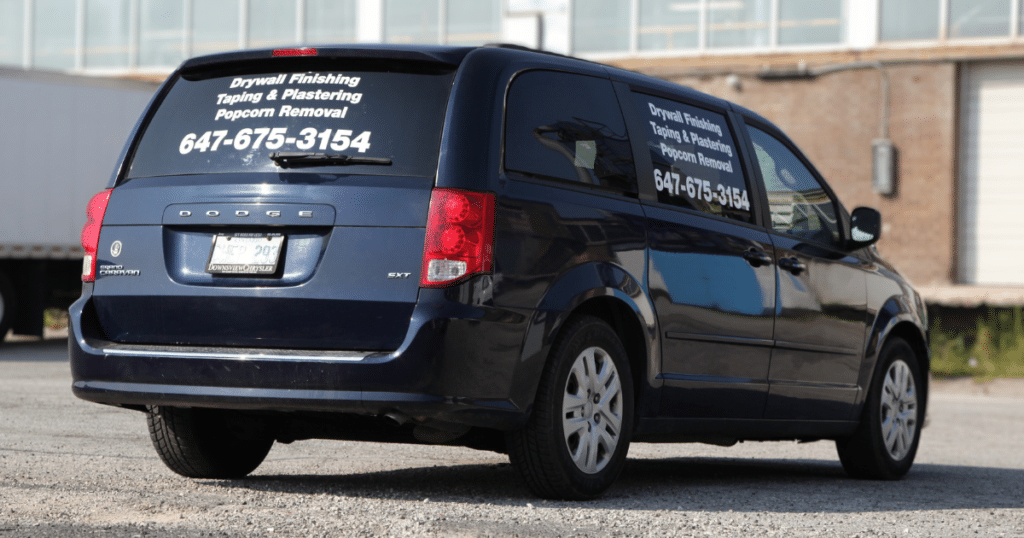 Rear view of a Dodge Caravan 2015 showcased with personalized car decals