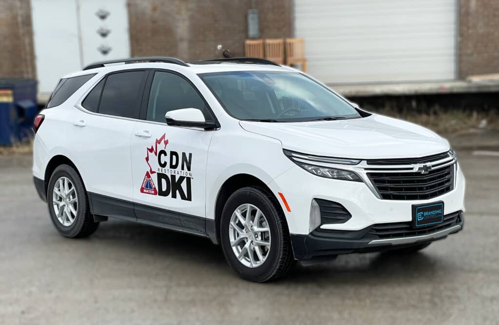 Side view of Chevrolet Equinox featuring lettering and decals installed by Branding Centres